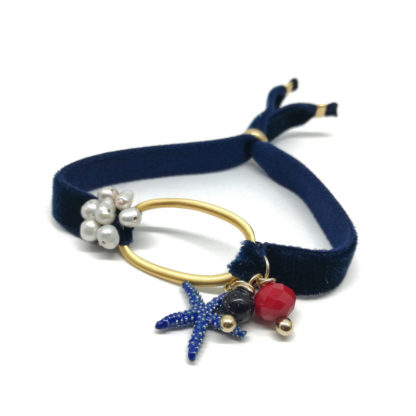 Pulsera elástica azul marino con perlas y estrella