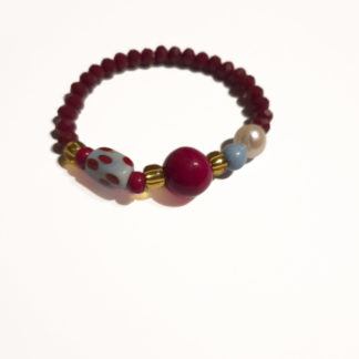 Pulsera granate y abalorios azules